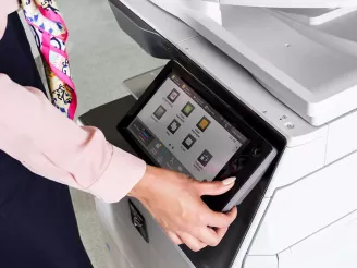 Woman using printers and photocopiers