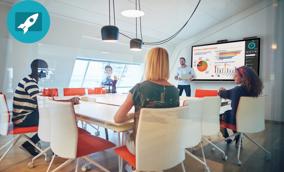 Five people at a table having a meeting